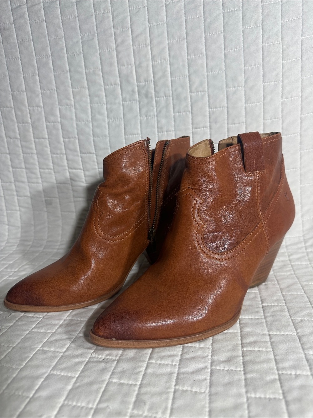 Frye Reina Booties in cognac leather, featuring a Western-inspired silhouette